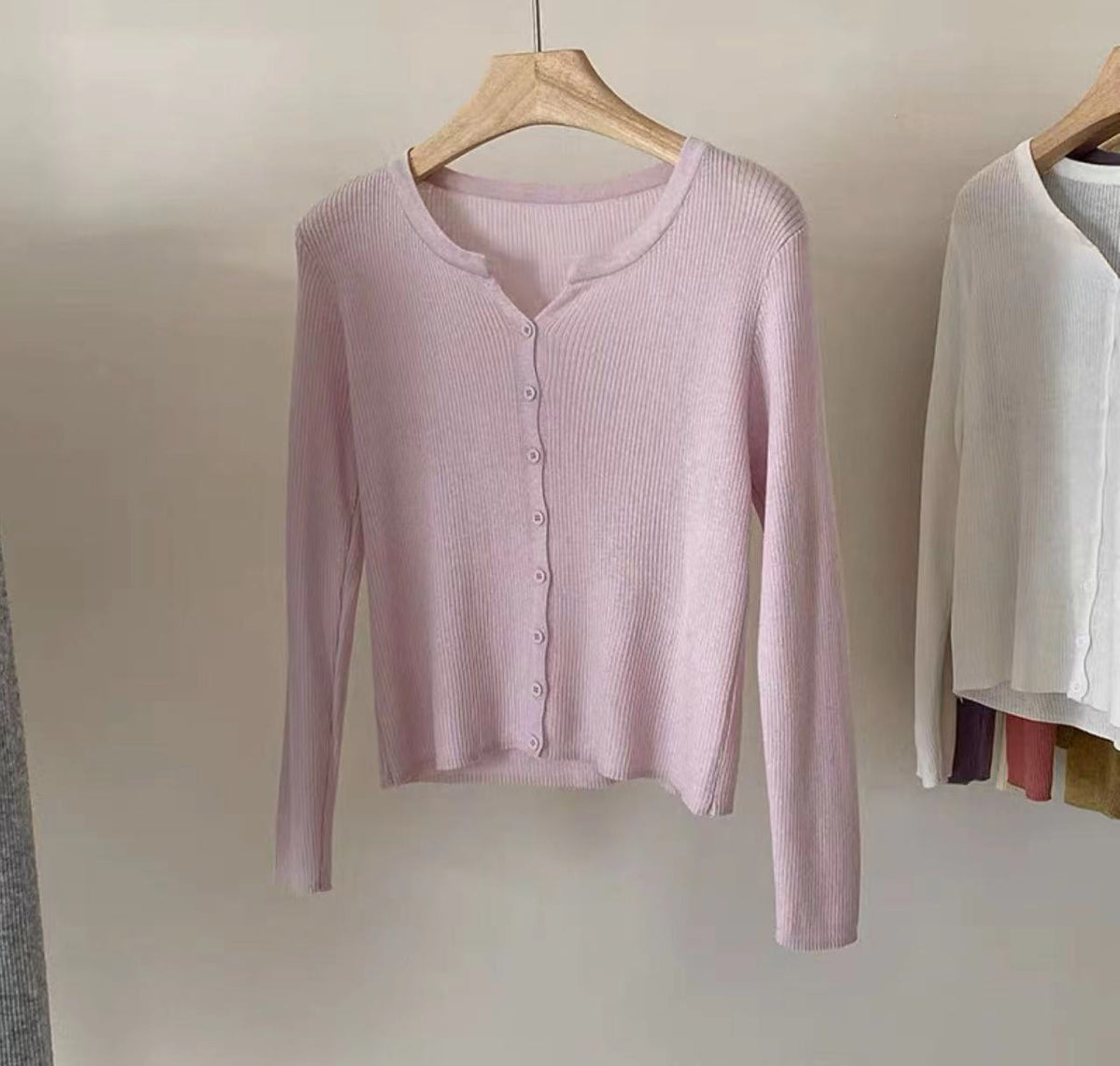 Women's figure-hugging cardigan with elegant button closure and fine ribbed texture NOVAE