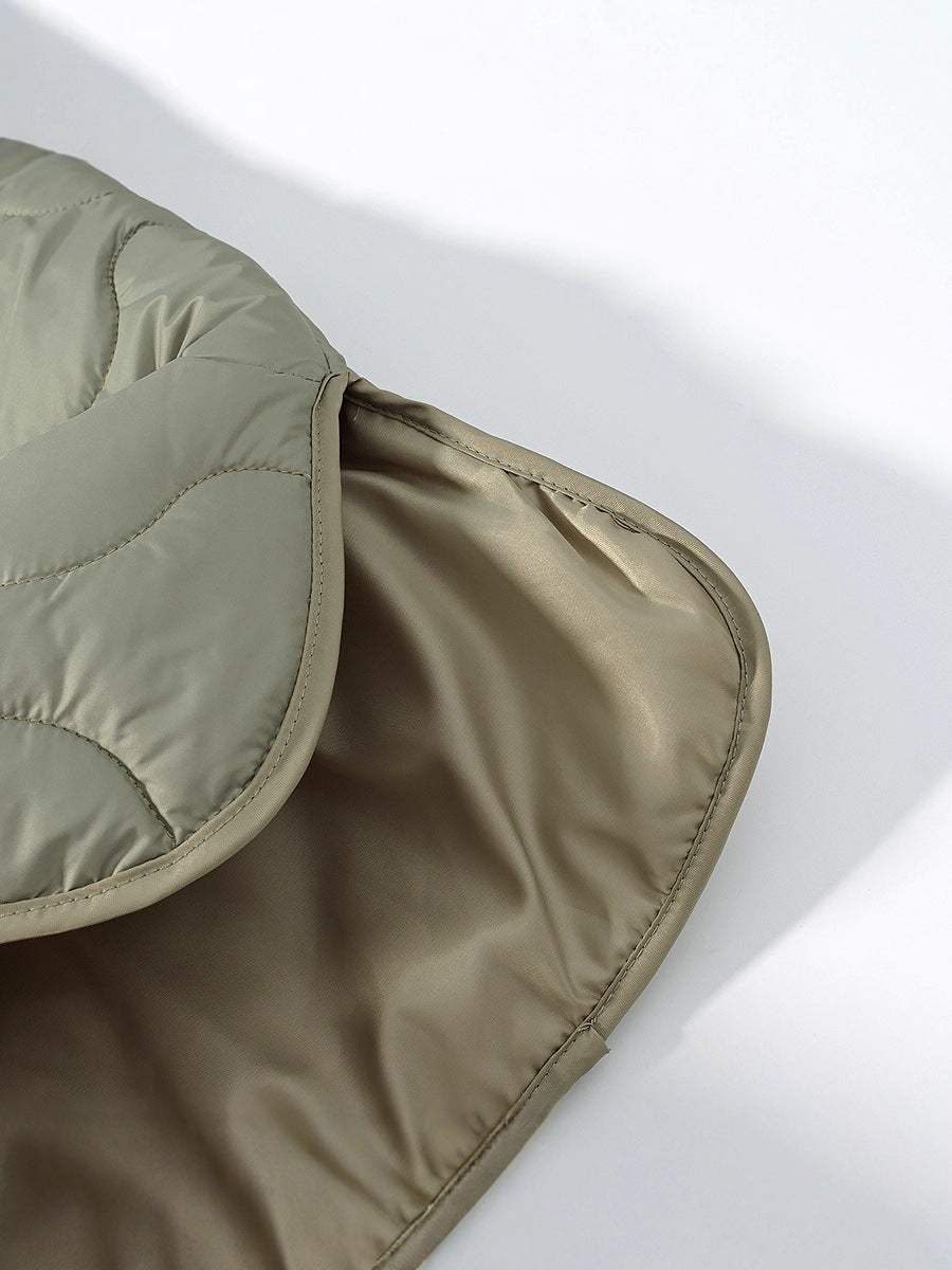 Women's quilted transitional jacket with soft fabric texture and practical snap fasteners NOVAE