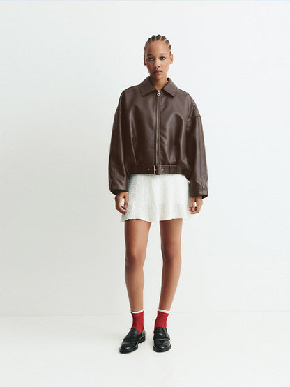 Women's fashionable faux leather jacket with a wide cut and waist belt NOVAE