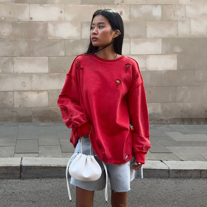 Women's casual oversized sweater with creative ripped details NOVAE