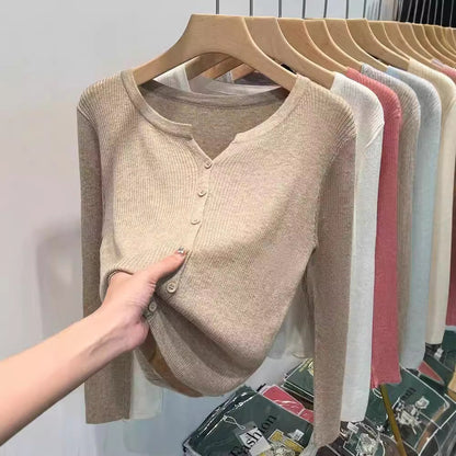 Women's figure-hugging cardigan with elegant button closure and fine ribbed texture NOVAE