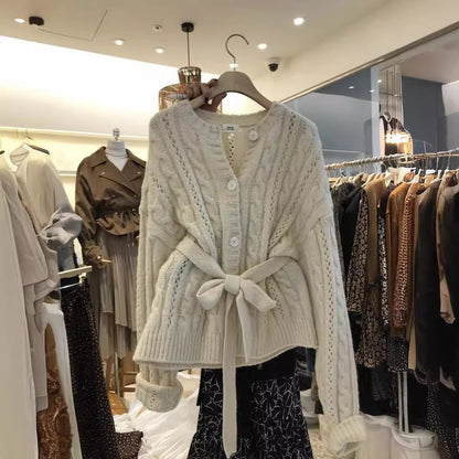 Women's cardigan with waist belt and cable knit pattern NOVAE