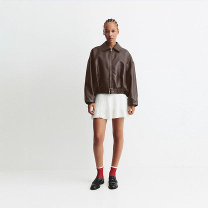 Women's fashionable faux leather jacket with a wide cut and waist belt NOVAE