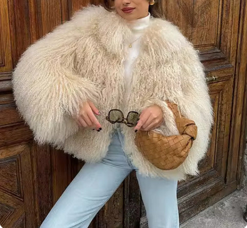 Women's fluffy faux fur jacket in a long cut with wide flared sleeves NOVAE
