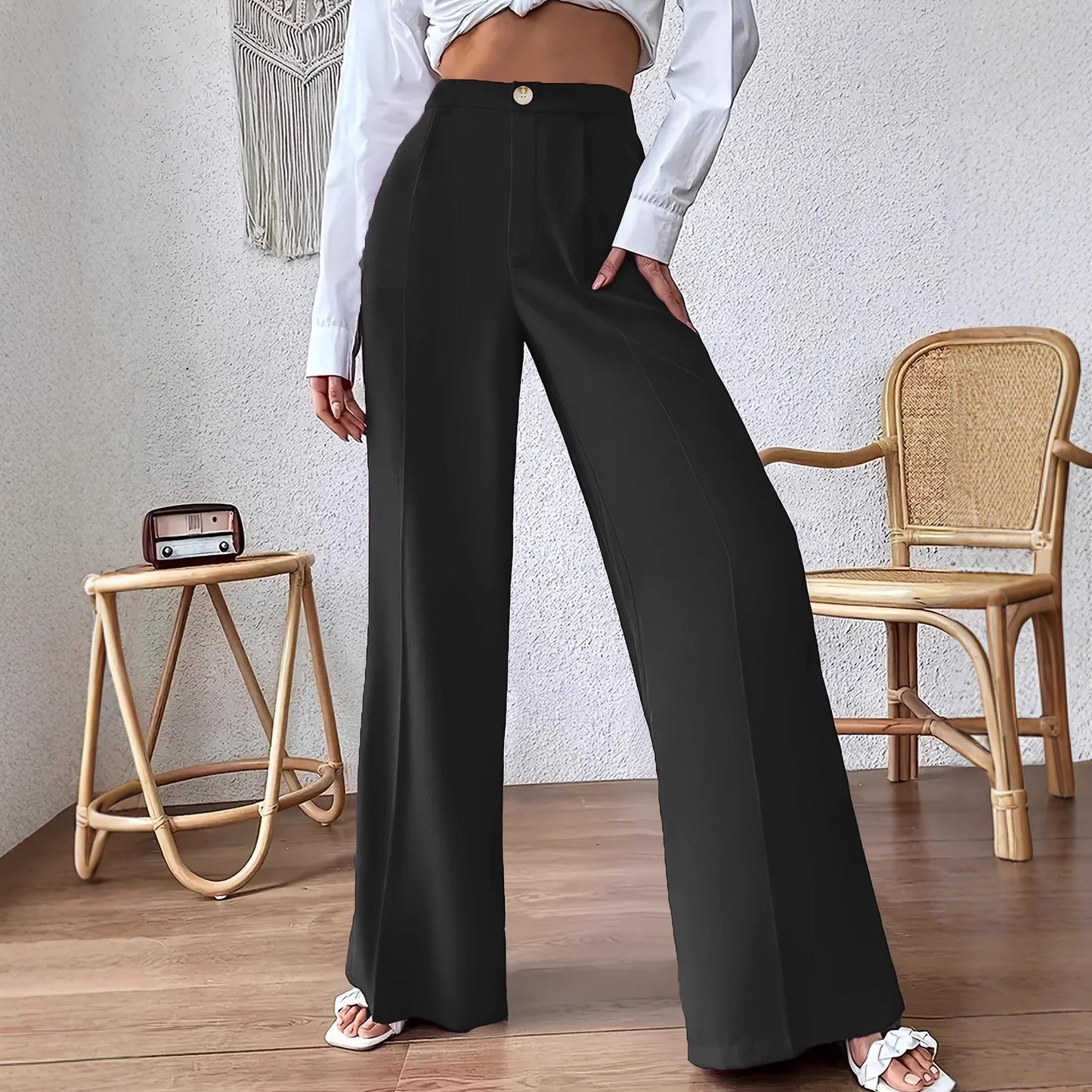 Women's high-waisted palazzo trousers with a narrow waistband and subtle button detail NOVAE
