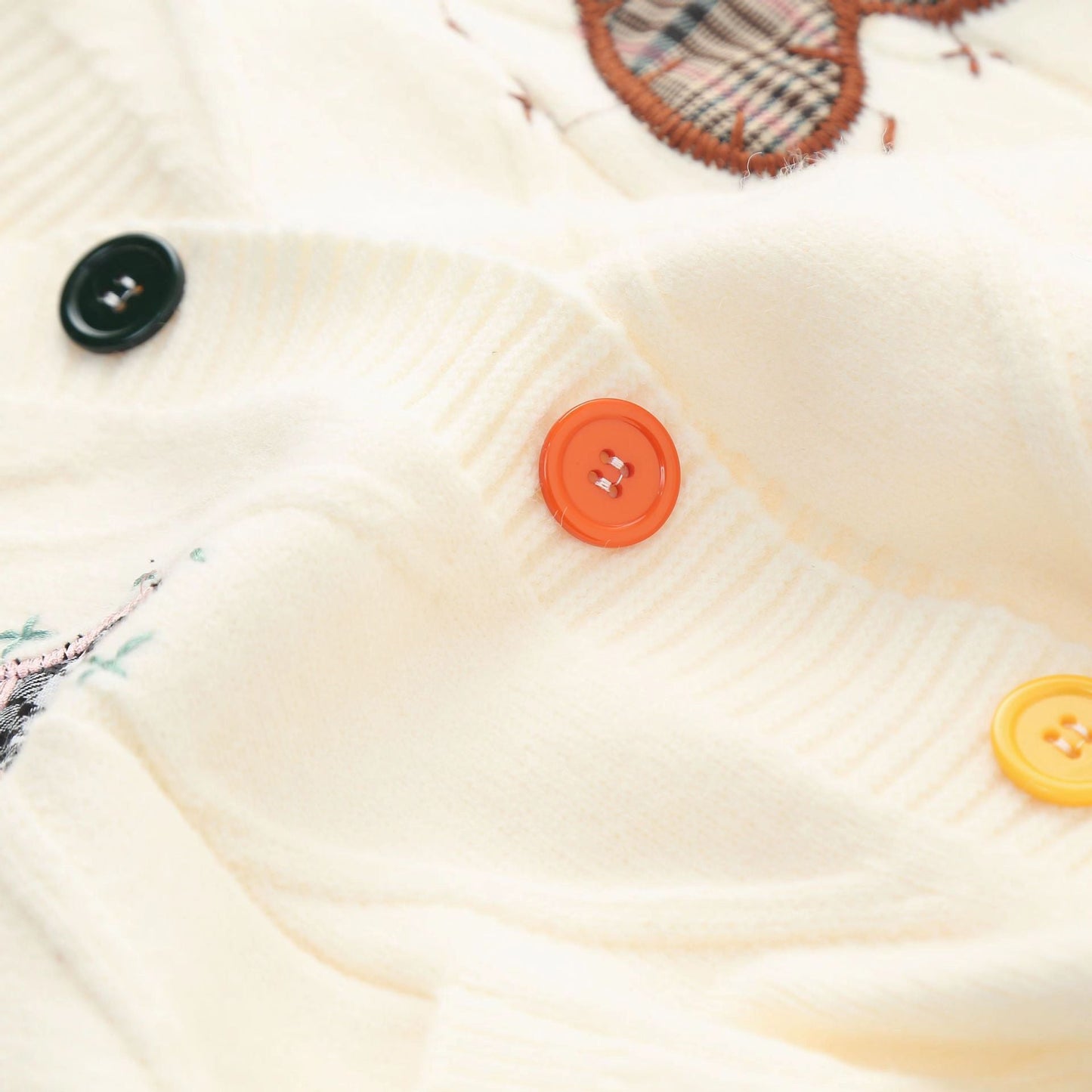 Women's cardigan with heart appliqués and button detailing NOVAE