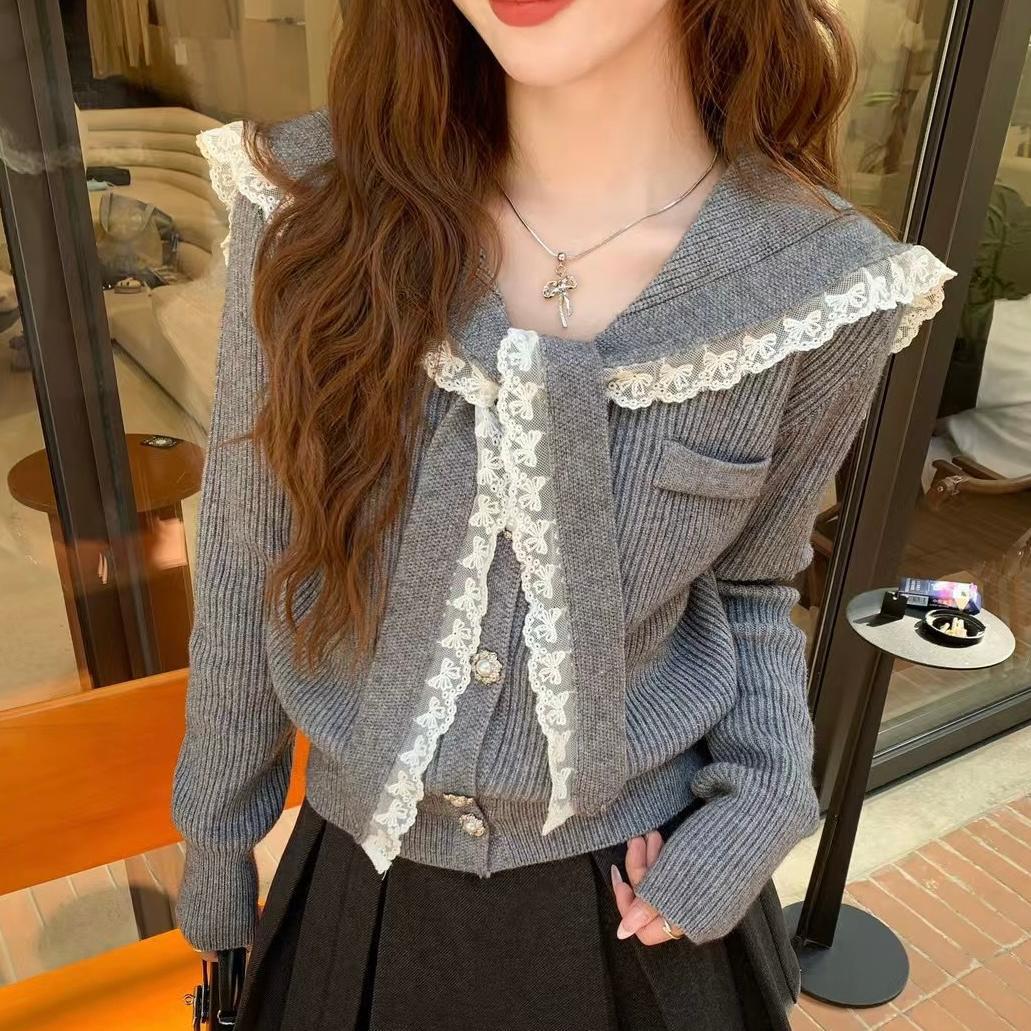 Women's cardigan with ruffled neckband and decorative buttons NOVAE