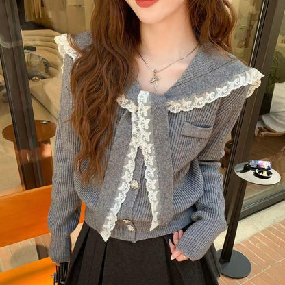 Women's cardigan with ruffled neckband and decorative buttons NOVAE