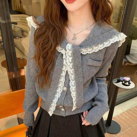 Women's cardigan with ruffled neckband and decorative buttons NOVAE