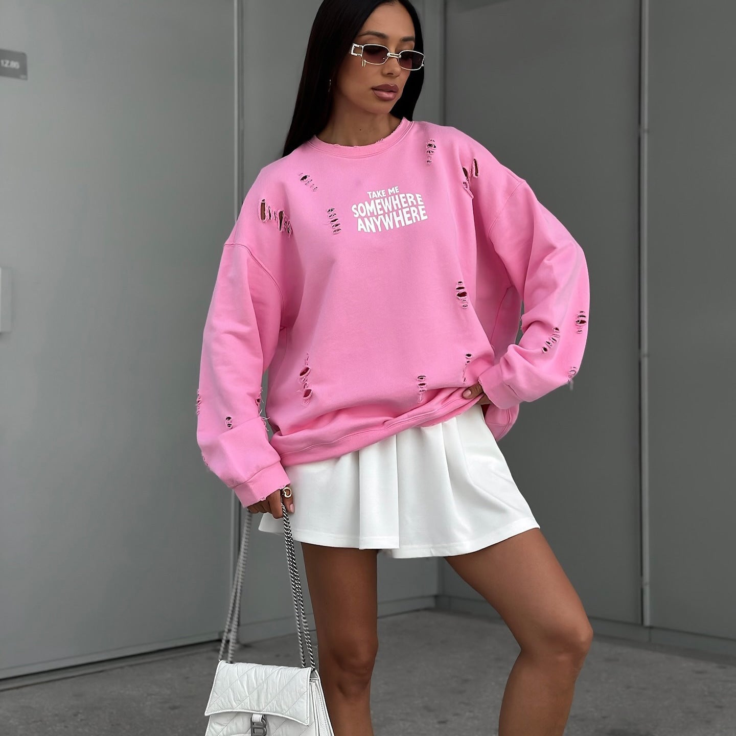 Women's casual oversized sweater with stylish ripped details NOVAE