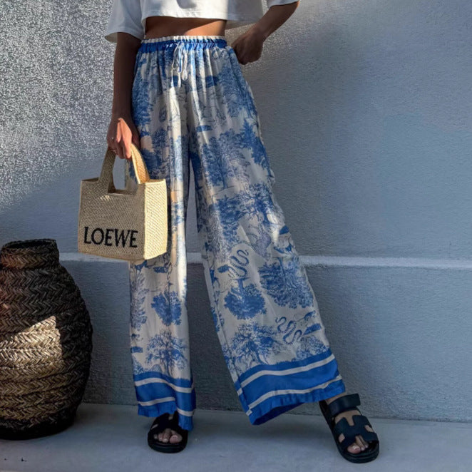 Women's wide-leg palazzo trousers with floral pattern and elasticated waistband NOVAE