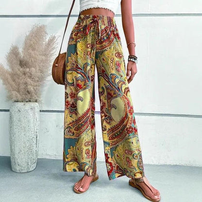 Women's wide-leg palazzo trousers with floral paisley pattern and elasticated waistband NOVAE