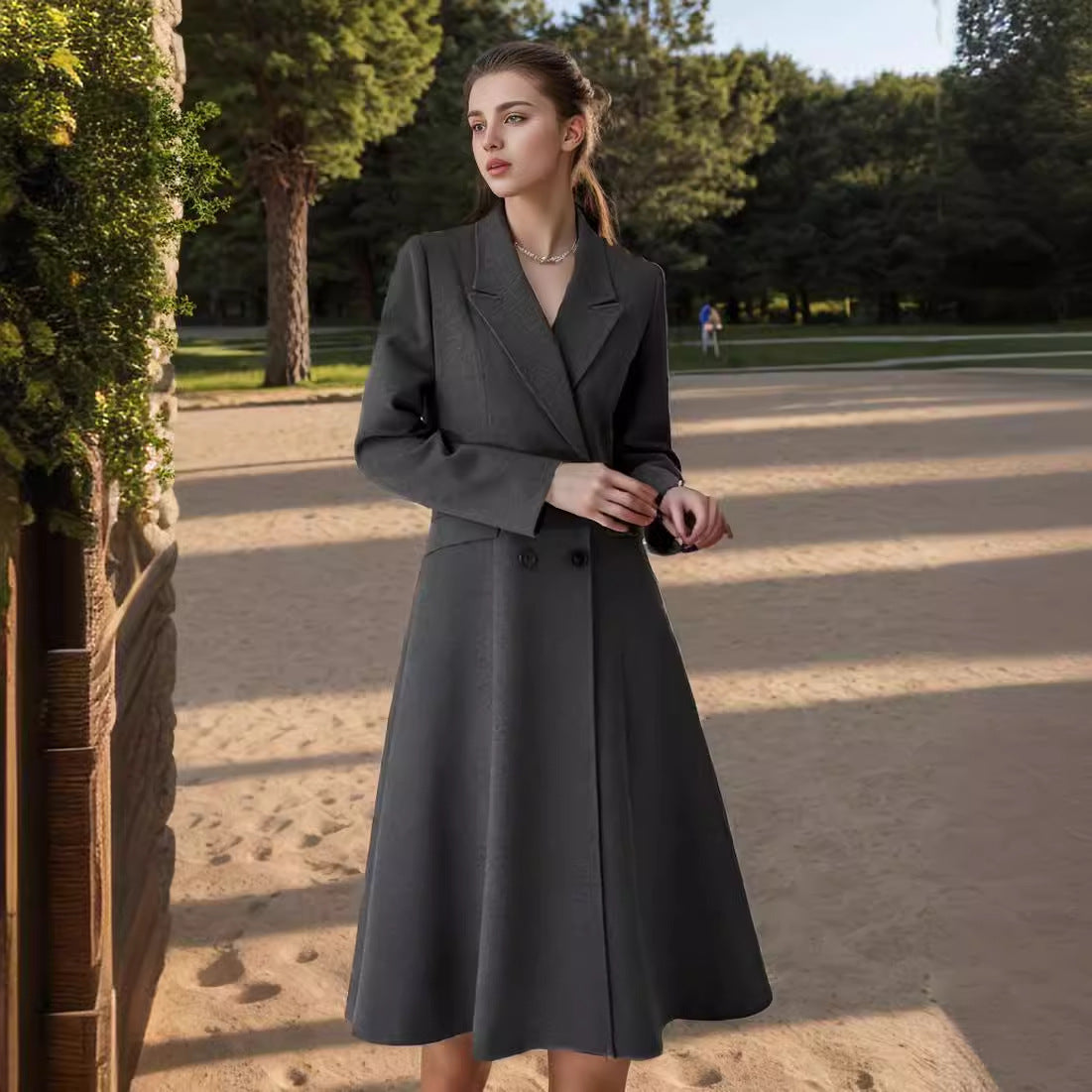 Women's elegant maxi coat with double-breasted button closure and wide, flowing skirt NOVAE