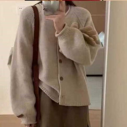 Women's cardigan with asymmetrical cut and generous balloon sleeves NOVAE