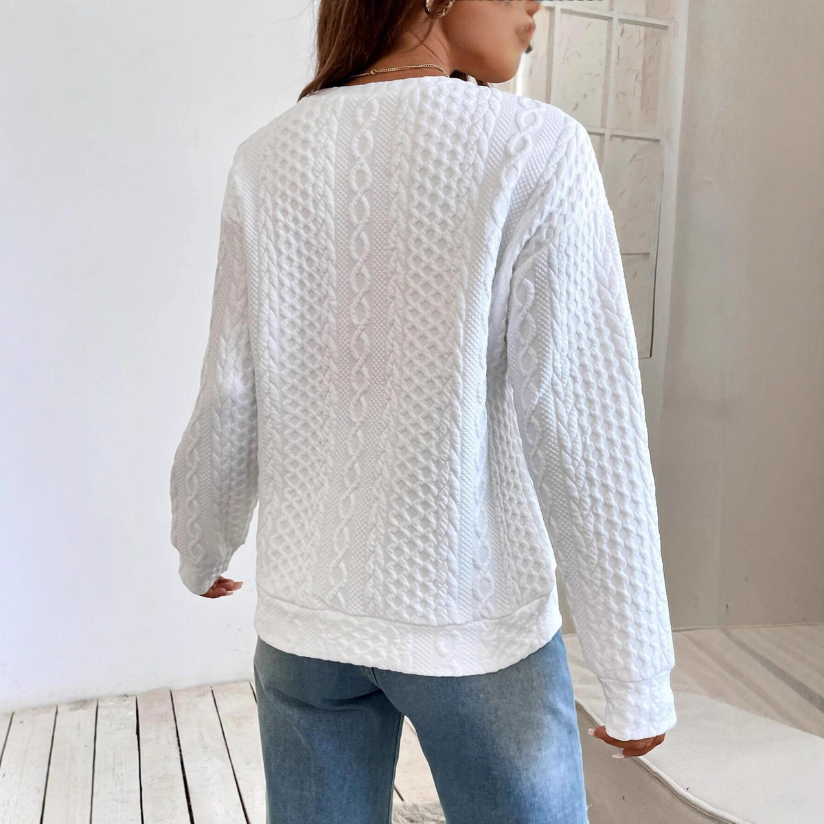 Women's knit sweater with textured surface and elegant round neckline NOVAE