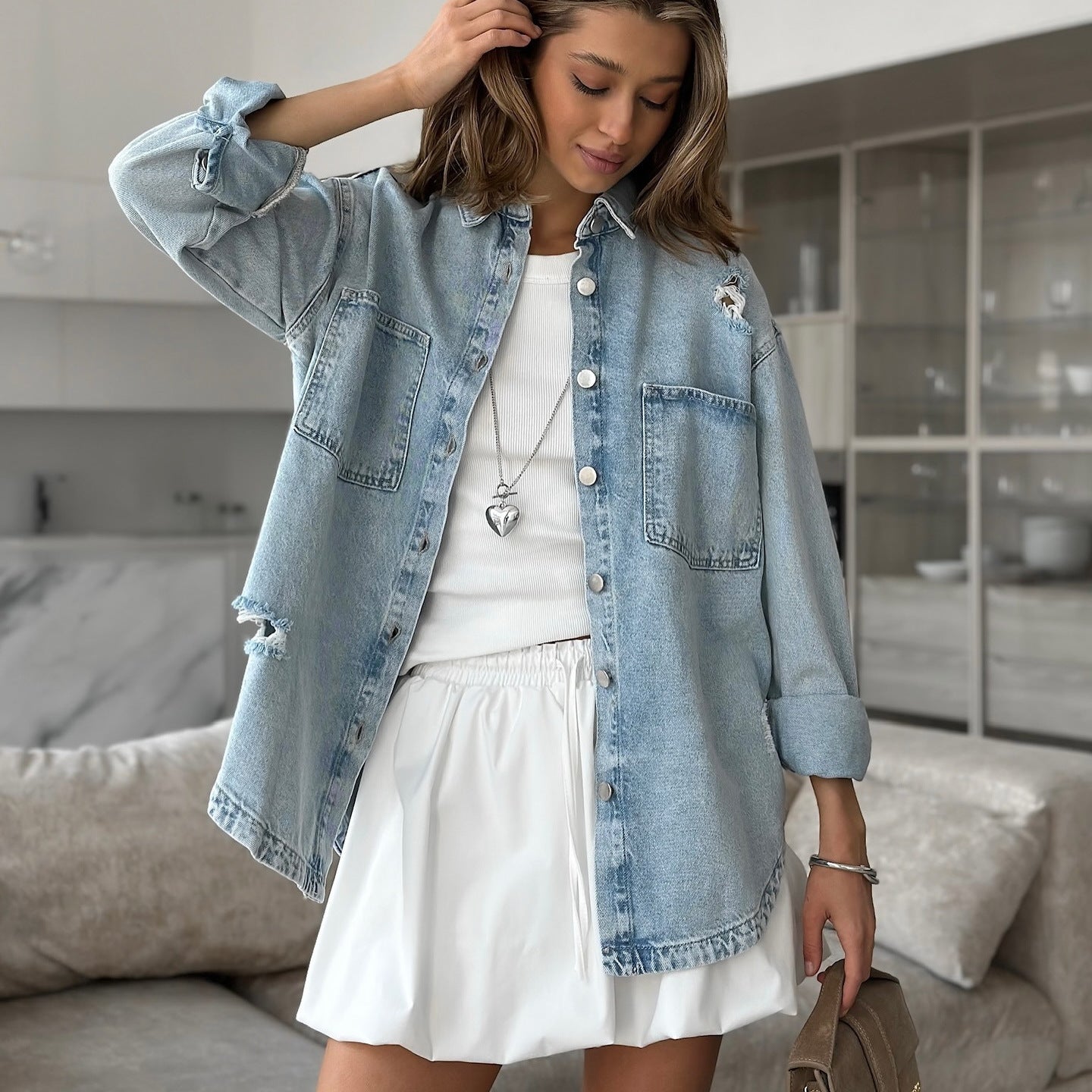 Women's denim jacket with a casual oversized cut and destructive details NOVAE