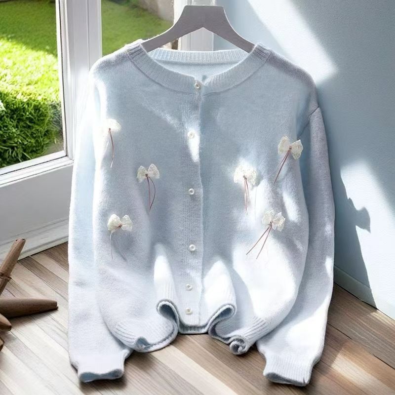 Women's cardigan with feminine appliqués and button details NOVAE