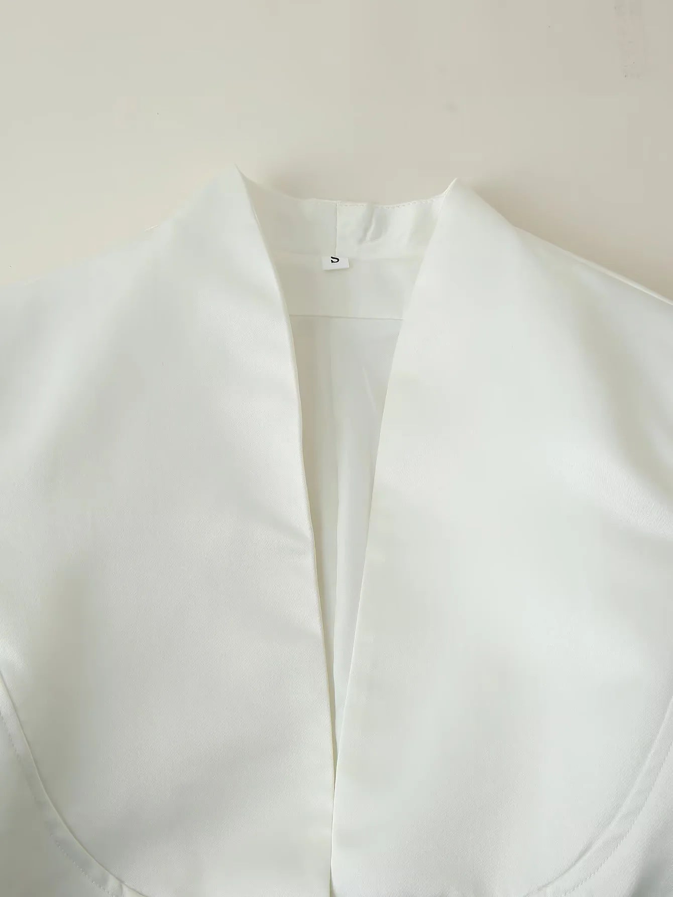 Women's fitted blouse with modern button details and stand-up collar NOVAE