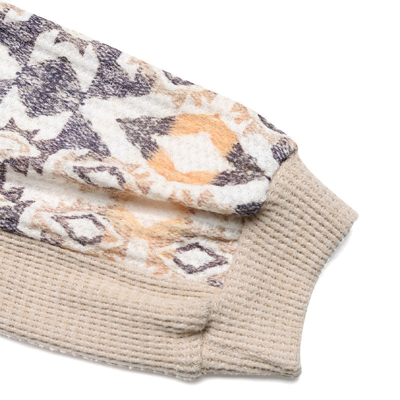 Women's knit sweater with modern raglan sleeves and floral pattern NOVAE