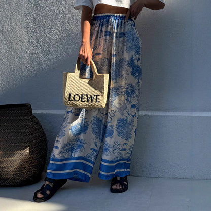 Women's wide-leg palazzo trousers with floral pattern and elasticated waistband NOVAE