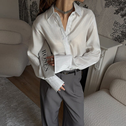 Women's elegant blouse with adjustable cuff design and button details NOVAE