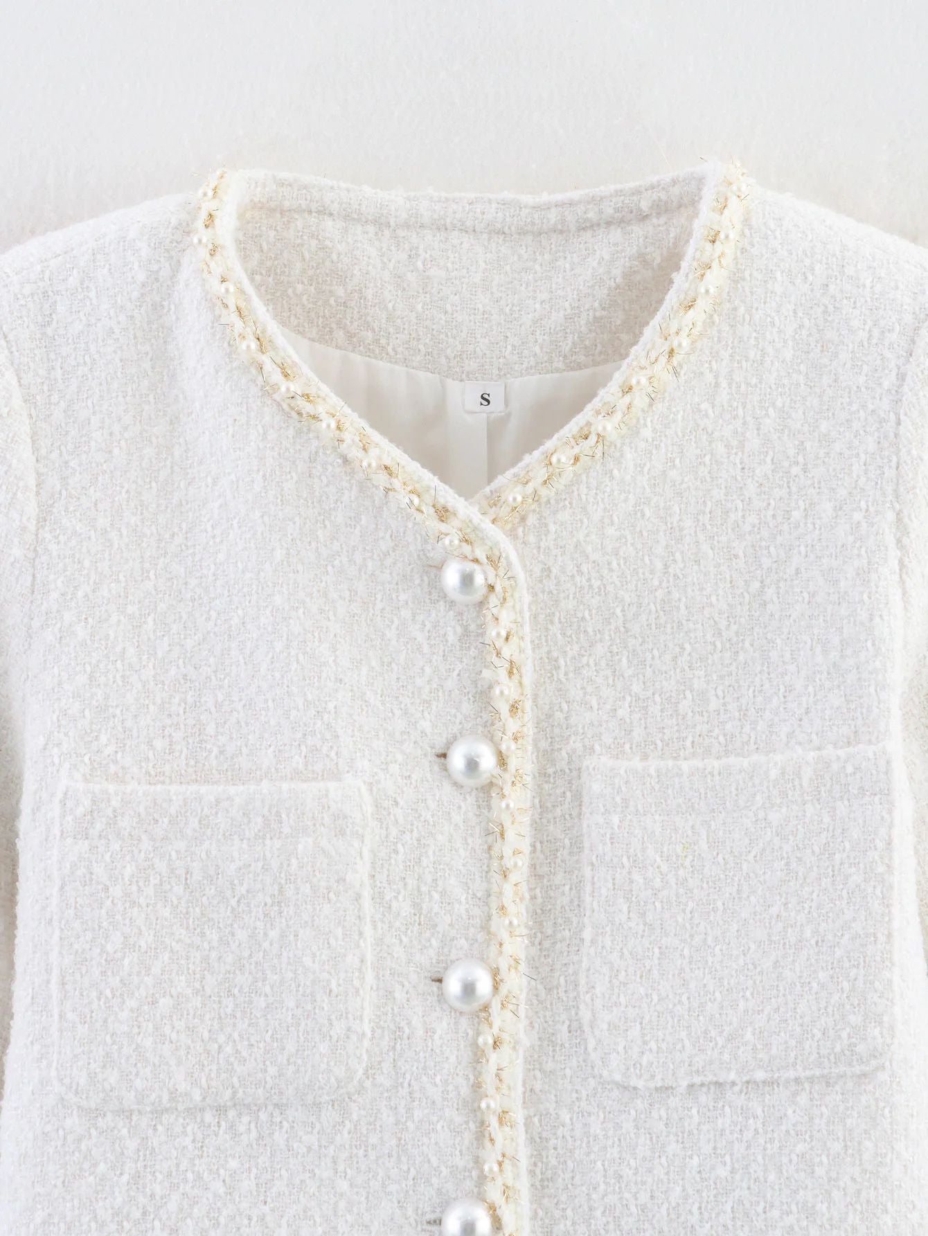 Women's elegant short-sleeved pullover jacket with pearl-decorated buttons and patch pockets NOVAE