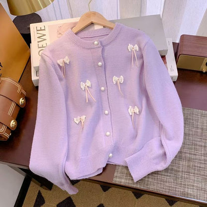 Women's cardigan with feminine appliqués and button details NOVAE