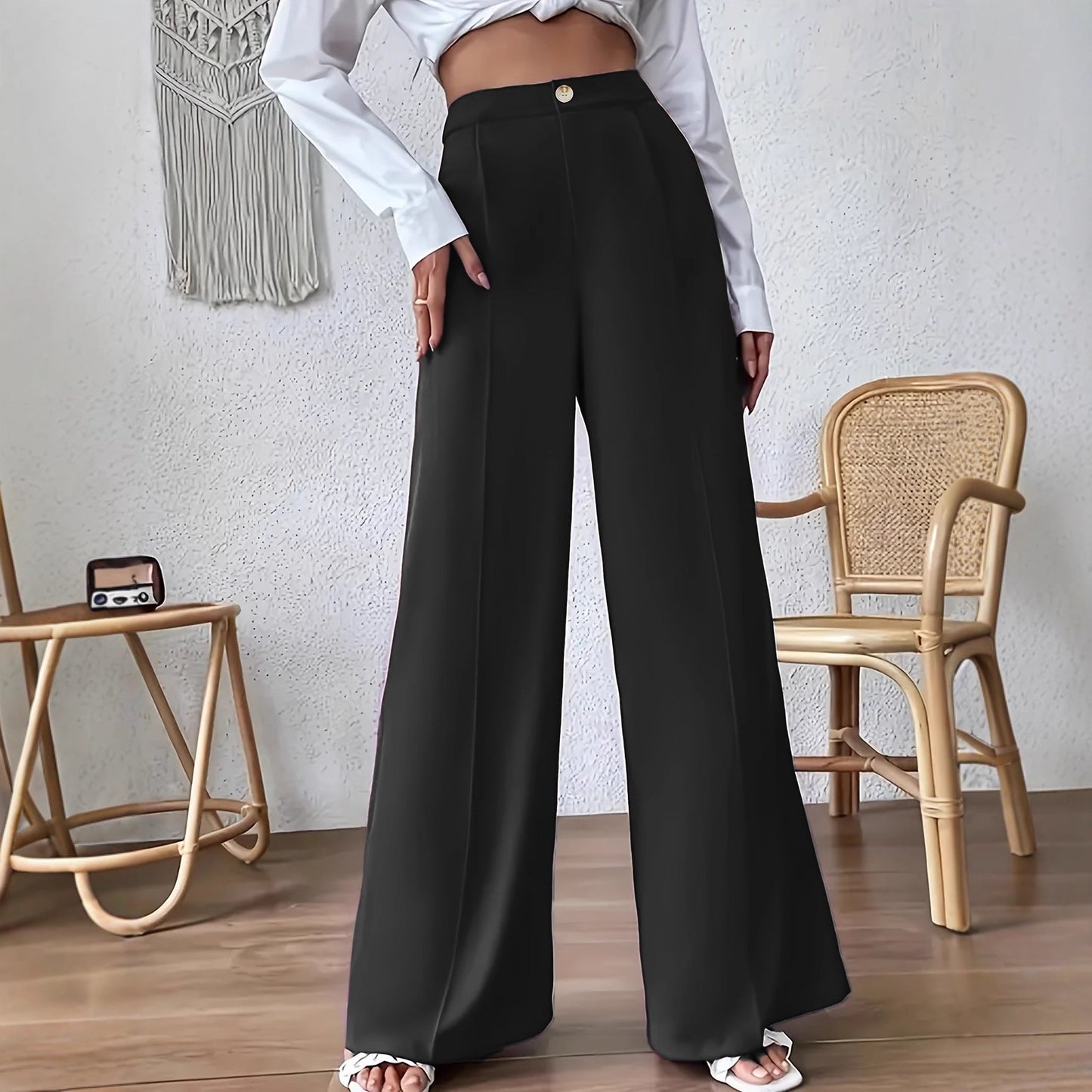 Women's high-waisted palazzo trousers with a narrow waistband and subtle button detail NOVAE